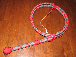 16 Plait Nylon bullwhip in whip makers pattern colors imperil red and silver.